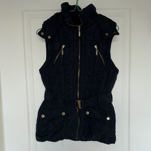 Black Sleeveless Puffer Vest with Gold Accents and Waistbelt